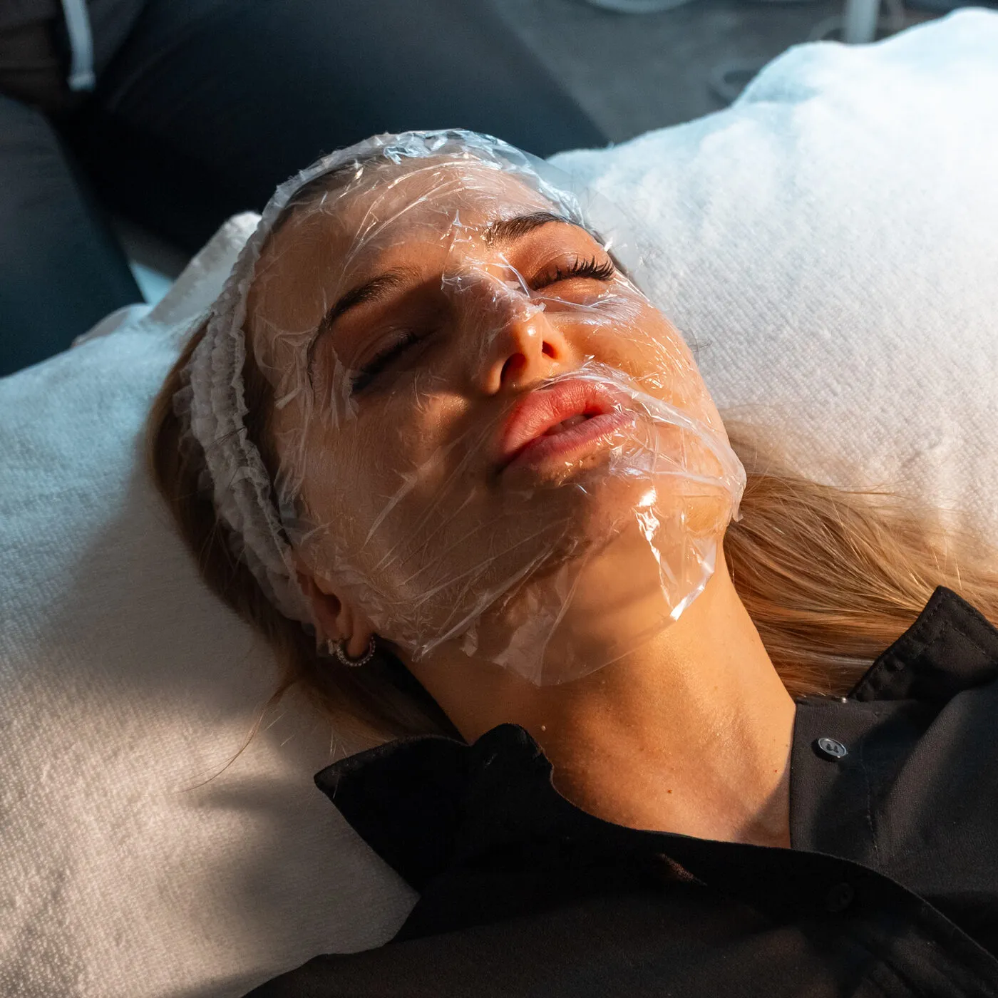 Esthetician performing a facial