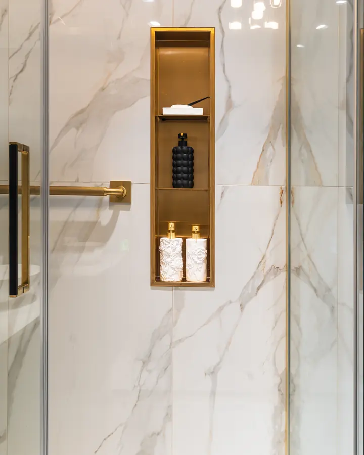 Marble and brass shower niche